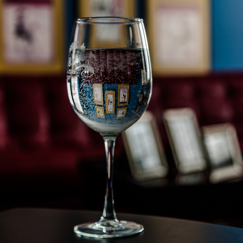 Photos Reflected in Wineglass by Stino